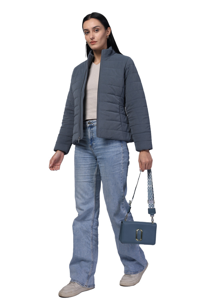 A model showcasing Women Quilted Jacket In Velvet Fabric With Concealed Zipper Pocket thumbnail.